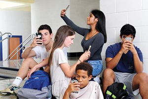 group-of-teenagers-on-cell-phones group-of-teenagers-on-cell-phones