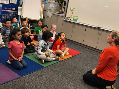 illumination-institute-k-2-students k-2-students-sitting-on-the-carpet