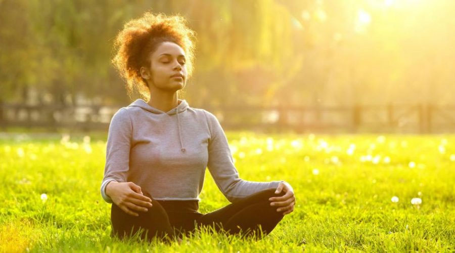 woman-meditating-in-a-field